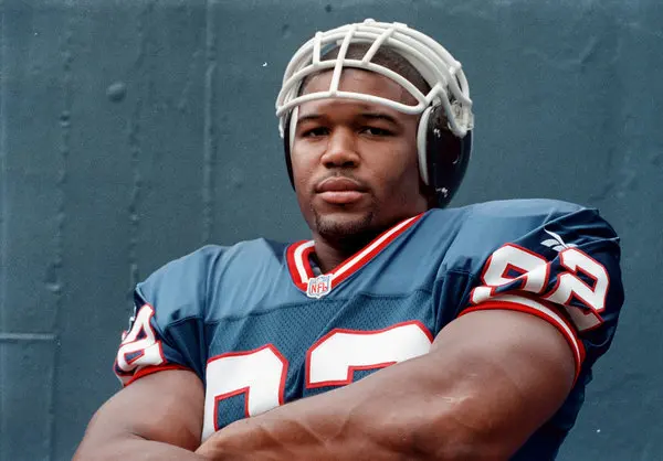 Young Michael Strahan sacking a quarterback during his dominant 2001 season with the New York Giants