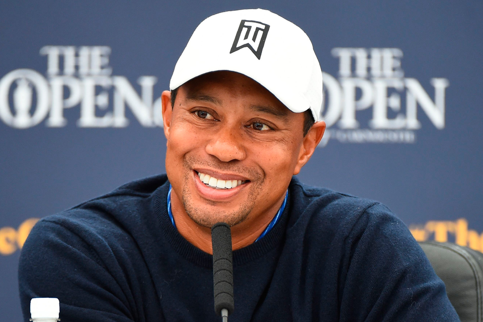 Tiger Woods celebrating a putt